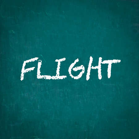 FLIGHT written on chalkboardの写真素材