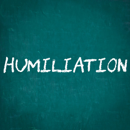 HUMILIATION written on chalkboardの写真素材