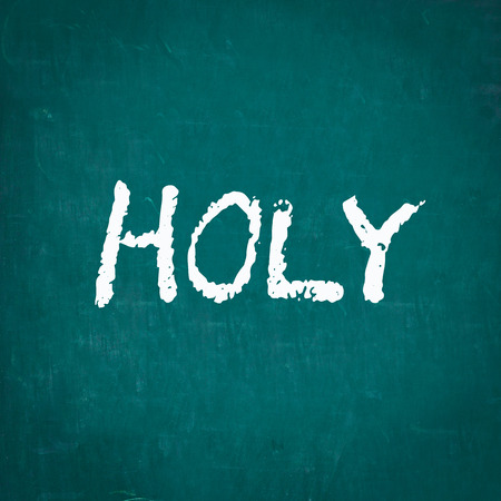 HOLY written on chalkboardの写真素材