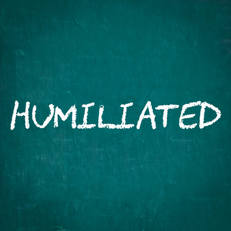 HUMILIATED written on chalkboardの写真素材