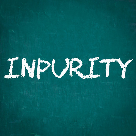 INPURITY written on chalkboardの写真素材