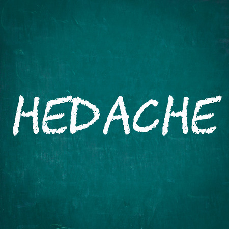 HEDACHE written on chalkboardの写真素材