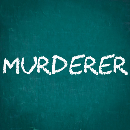 MURDERER written on chalkboardの写真素材