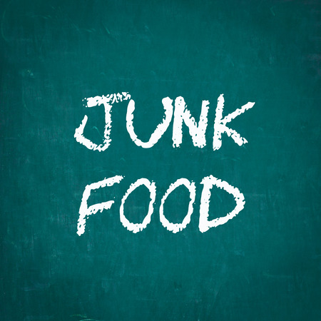 JUNK FOOD written on chalkboardの写真素材