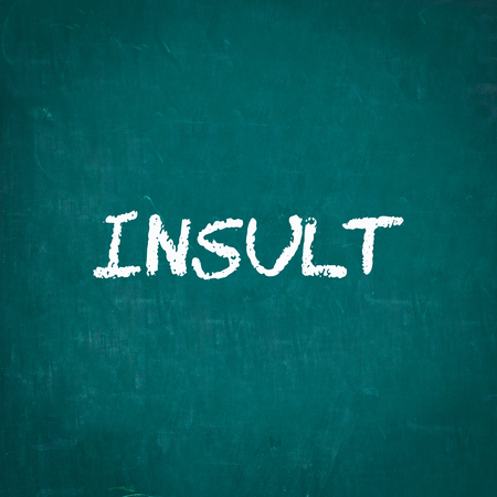 INSULT written on chalkboardの写真素材
