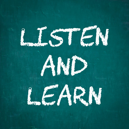 LISTEN AND LEARN written on chalkboardの写真素材