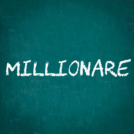MILLIONARE written on chalkboardの写真素材