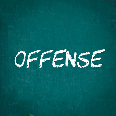 OFFENSE written on chalkboardの写真素材