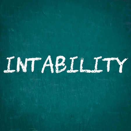 INSTABILITY written on chalkboardの写真素材