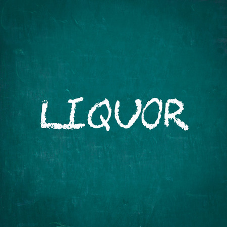LIQUOR written on chalkboardの写真素材