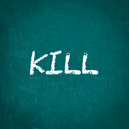 KILL written on chalkboardの写真素材