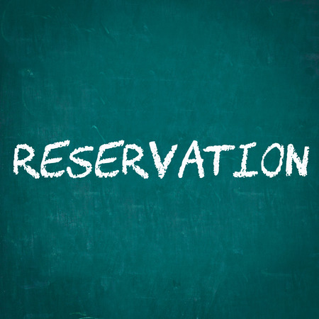 RESERVATION written on chalkboardの写真素材