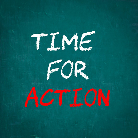 TIME FOR ACTION written on chalkboardの写真素材