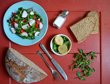 Fresh salad with breadの写真素材
