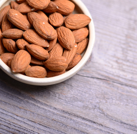 Almonds on wooden backgroundの写真素材