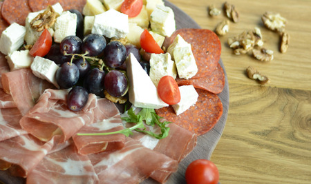 Greek salad with ham and grapes closeupの写真素材