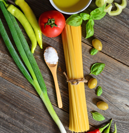 Ingredients for spaghetti bolognese on wooden backgroundの写真素材