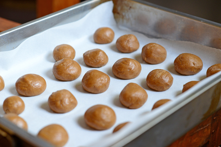 Ginger ball cookies in brassの写真素材
