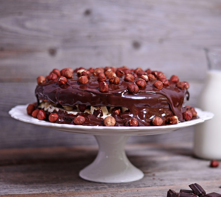 Delicious chocolate cakes with hazelnut on wooden tableの写真素材