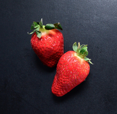 Strawberry on blackboardの写真素材