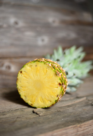 Pineapple on wooden tableの写真素材