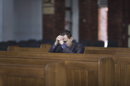 Man praying in church