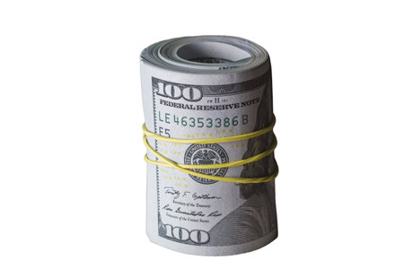 The banknotes twisted in a tube and drawn by a rubber plaitの写真素材