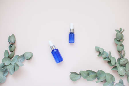 Bottles with face serum on a light background. Beauty industry. Layoutの写真素材