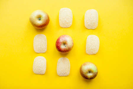 A layout of chips and apples in the form of a tic-tac-toe game. Weight loss and diet concept. High quality photoの写真素材