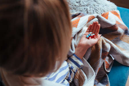 a handful of tealets in ginseng's hand. disease and pandemic concept.の写真素材