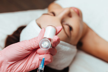 the doctor gives an injection into the woman's cheekbone. cosmetology close-up