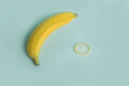 Sex education and safe sex. Banana and condom concept of the penis in contraceptionの写真素材