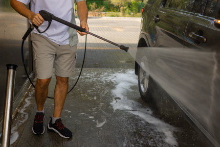 He loves his car. Man washing car.の写真素材