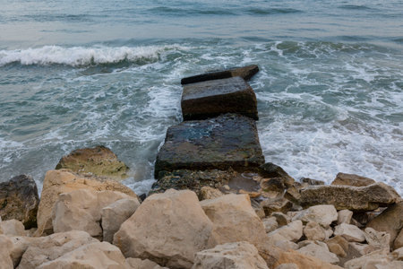 The beautiful coast of the city of Varna in Bulgaria. The sea beats against the stones, amazing seascapeの写真素材