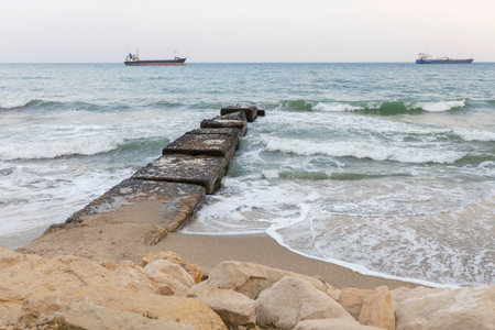 The beautiful coast of the city of Varna in Bulgaria. The sea beats against the stones, amazing seascapeの写真素材