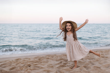 Little girl enjoying summer vacation at the seaの写真素材