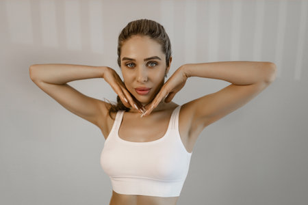 Portrait of young beautiful woman with perfect smooth skin isolated over background. Tenderness and sensuality. Concept of natural beauty, plastic surgery, cosmetology, cosmetics, skin careの写真素材