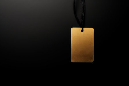 Gift box and golden ribbon on black background with glitter. Black friday sale concept. Bannerの素材