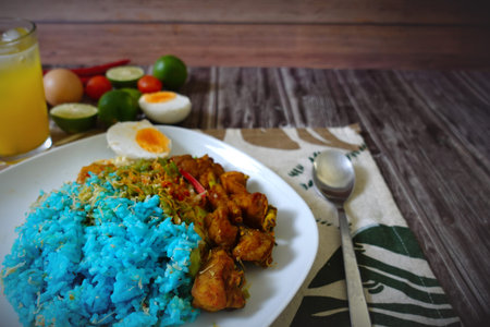 Malaysian traditional meal rice mixed with selected vegetables and stir fried chicken