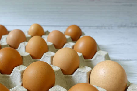 Chicken eggs lined on egg cartonの写真素材
