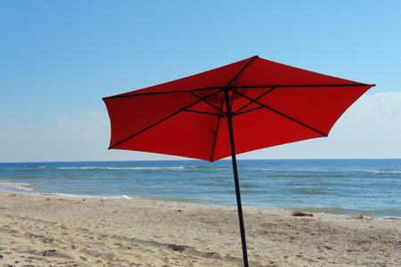 Beach sandals on the pebble coast  A pair of flip-flops on the pebble beach           の写真素材
