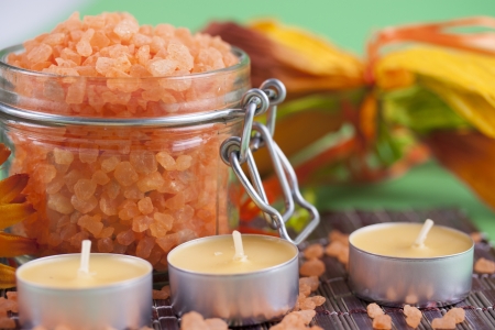 Aromatherapy and relaxation - colorful orange bath salt in a glassの写真素材