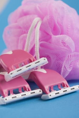 Making her legs pretty and smooth - female pink shaving razorの写真素材