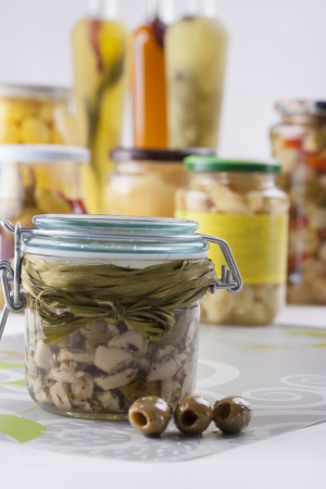 Pickle Jar - winter ideas - taste of summer on your table  olives and garlic in a olive oil の写真素材