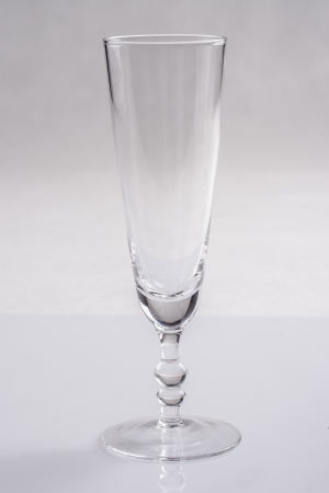 Champagne glass over a solid bright backgroundの写真素材