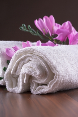 Clean and fresh ideas - white towels with a pink flowersの写真素材
