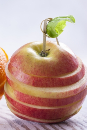 Composition of vegetarian healthy food - sliced fruits on a wooden background.の写真素材