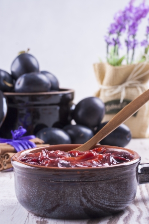 A close up photo of sweet fruits dessert - plum jam, also known as plum powidl.の写真素材