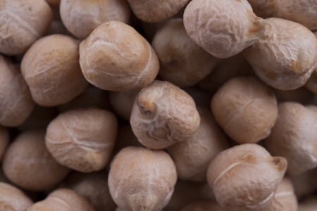Close up photo of a raw food - brown seeds - chickpeas.の写真素材
