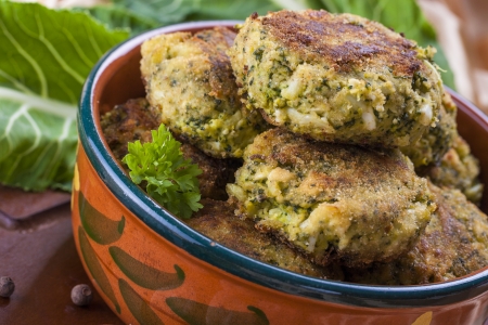 Exotic dinner - broccoli chops with mixed eggs and bread crumbs placed in the brown clay pot の写真素材
